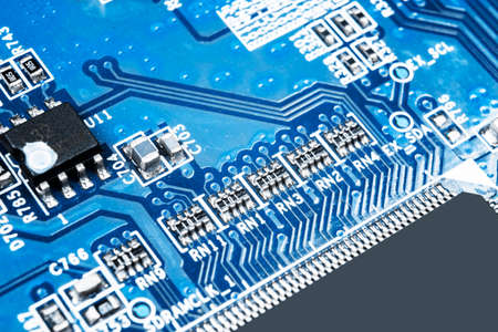 Macro shot of a Circuitboard with resistors microchips and electronic components. Computer hardware...