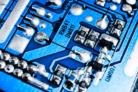 Macro shot of a Circuitboard with resistors microchips and electronic components. Computer hardware...