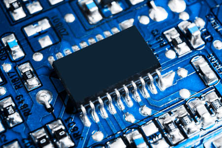 Macro shot of a Circuitboard with resistors microchips and electronic components. Computer hardware...