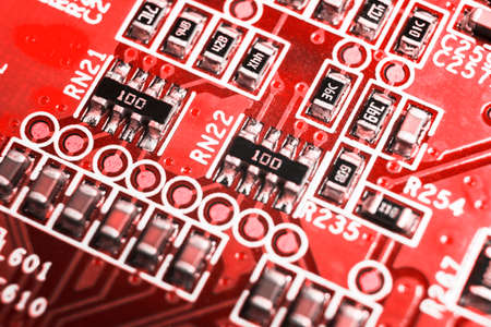 Macro shot of a Circuitboard with resistors microchips and electronic components. Computer hardware...