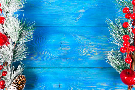 Christmas concept. Christmas fir tree with decoration on rustic vintage board. Pine branches. Fir cones. Snow on wood. Xmas and Happy New Year composition. Copy space. Empty space. Top view. Christmas backgroundの写真素材
