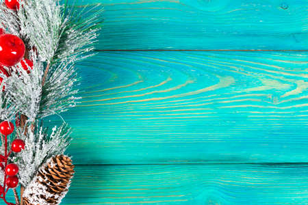 Christmas concept. Christmas fir tree with decoration on rustic vintage board. Pine branches. Fir...