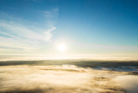 Aerial view clouds over forest during winter colors. Aerial view of forest and clouds. Coastline....