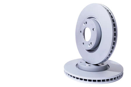 Two Car Brake disc isolated on white background. Auto parts. Brake disc rotor isolated on white. Braking disk. Car part. Car detailing. Spare partsの写真素材