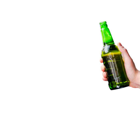 A man hand holding beer bottle isolated on white background. Clipping path of green glass bottle on white background. Empty space. Copy spaceの写真素材