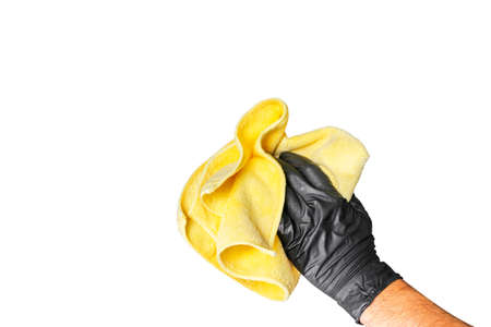 Washing concept. A male man hand with cloth isolated on white background. Worker cleaning. Cleaning with cloth, foam and brush. Cleaning concept. Hand in black protective rubber gloveの写真素材