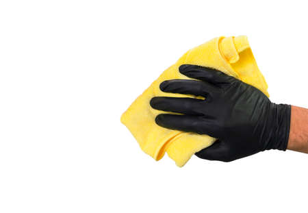 Washing concept. A male man hand with cloth isolated on white background. Worker cleaning. Cleaning with cloth, foam and brush. Cleaning concept. Hand in black protective rubber gloveの写真素材