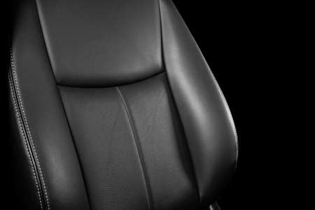 Black leather interior of the luxury modern car. Perforated Leather comfortable seats with stitching...