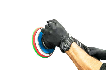 Car polish wax worker hands holing polishing tool isolated on white background. Buffing and...