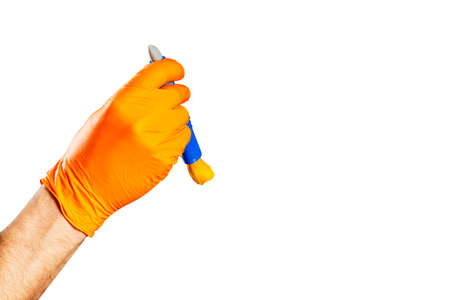 Washing concept. A male man hand with brush isolated on white background. Worker cleaning. Cleaning with cloth, foam and brush. Cleaning concept. Hand in orange protective rubber gloveの写真素材