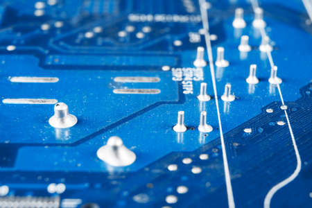 Macro shot of Circuit board with resistors microchips and electronic components. Computer hardware...