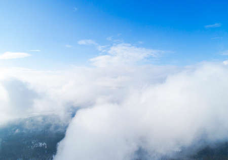 Aerial view White clouds in blue sky. Top view. View from drone. Aerial bird's eye view. Aerial top view cloudscape. Texture of clouds. View from above.の写真素材