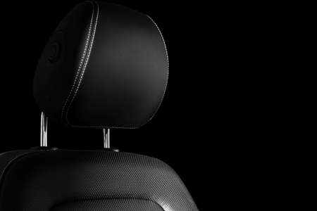 Modern luxury car leather interior. Part of leather car seat details with white stitching. Interior of prestige car. Comfortable perforated leather seats. Perforated leather. Car detailing. Black and whiteの写真素材