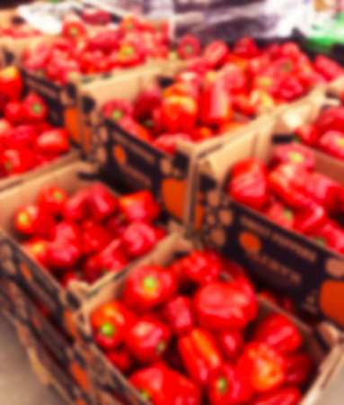 Blurred bacground with Fresh pods of red peppers i supermarket store. Close up. Blur bokeh lights. Abstract blurred supermarket store. Interior shopping mall defocused backgroundの写真素材
