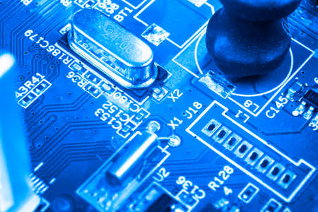 Macro shot of Circuit board with resistors microchips and electronic components. Computer hardware...