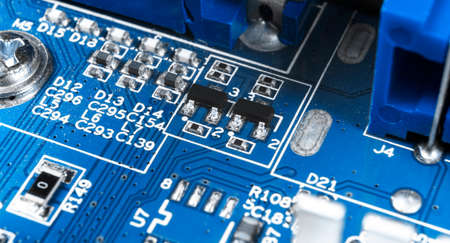 Macro shot of Circuit board with resistors microchips and electronic components. Computer hardware...