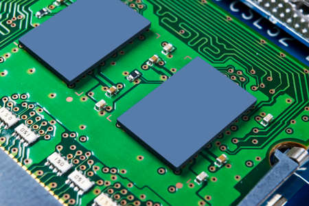 Macro shot of Circuit board with resistors microchips and electronic components. Computer hardware...