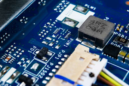 Macro shot of Circuit board with resistors microchips and electronic components. Computer hardware...
