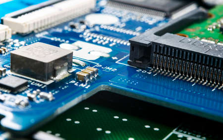 Macro shot of Circuit board with resistors microchips and electronic components. Computer hardware technology. Integrated communication processor. Information engineering. Semiconductor. PCB. Closeupの写真素材