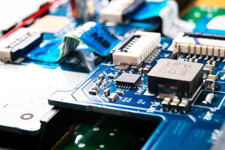 Macro shot of Circuit board with resistors microchips and electronic components. Computer hardware...