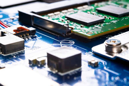Macro shot of Circuit board with resistors microchips and electronic components. Computer hardware...