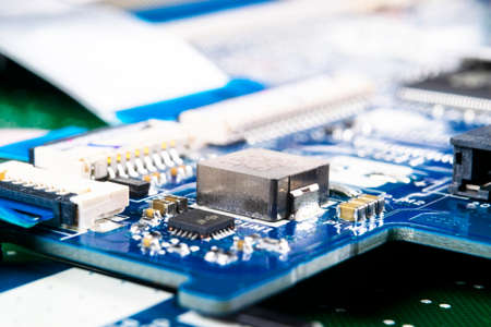 Macro shot of Circuit board with resistors microchips and electronic components. Computer hardware...
