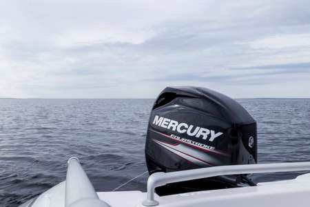 Helsinki, Finland, May 20, 2019: Modern new fishing sport boat with a brand new Mercury FourStroke...