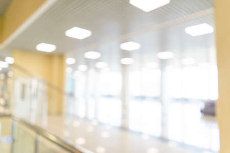 Blurred defocused bokeh background of exhibition hall or convention center hallway. Business trade...