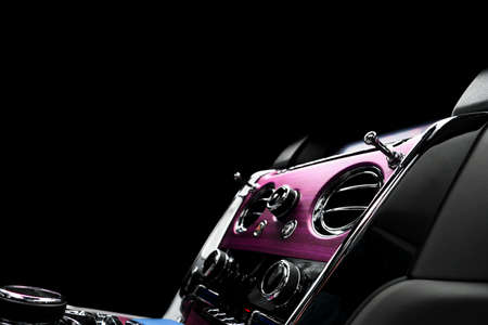 Modern luxury car white leather interior with natural wood panel. Part of leather car seat details with stitching. Interior of prestige modern car. White perforated leather. Car detailing. Car insideの写真素材