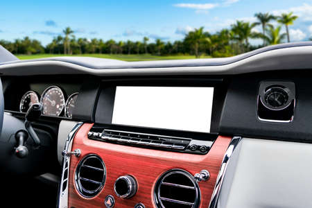 Monitor in car with isolated blank screen use for navigation maps and GPS. Isolated on white with...