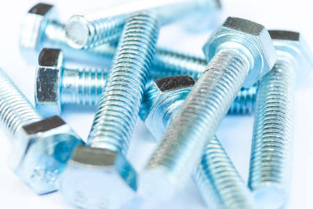 Metal bolts in a row background. Chromed screw bolts isolated. Steel bolts pattern. Set of Nuts and...