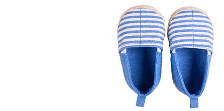 Small pair of shoes Isolated on a white background. Children's shoes isolated on white background. Baby shoes isolated.の写真素材