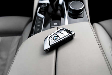 Helsinki, Finland, November 4, 2019: Close up of modern wireless keys of BMW 650i 2019 in white...