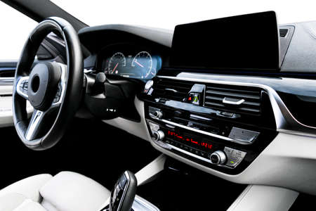 Modern luxury car white leather interior with natural wood panel. Part of leather car seat details...