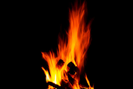 Fire texture isolated on black background. Fire flames on black background. Fire patterns. Texture...