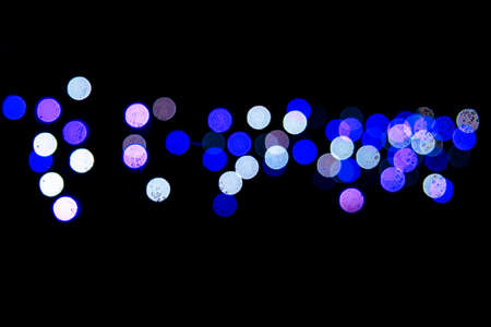 Bokeh with multi colors dots. Festive lights bokeh background. Defocused bokeh lights. Blurred...