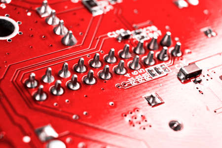Macro shot of Circuit board with resistors microchips and electronic components. Computer hardware...