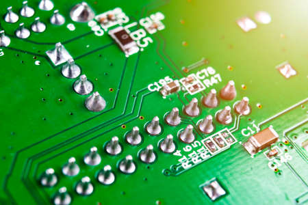 Macro shot of Circuit board with resistors microchips and electronic components. Computer hardware...