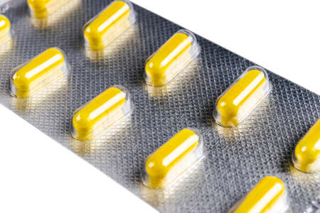 Pile of tablets pill in blister packaging. Silver aluminium foil blister pack. Pharmaceutical...