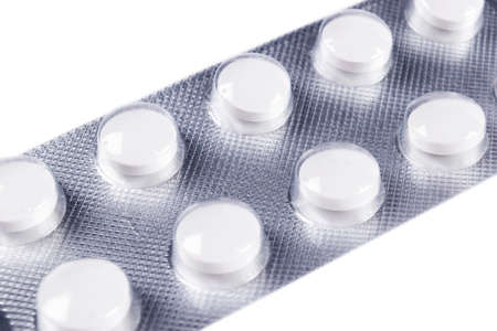 Pile of tablets pill in blister packaging. Silver aluminium foil blister pack. Pharmaceutical...