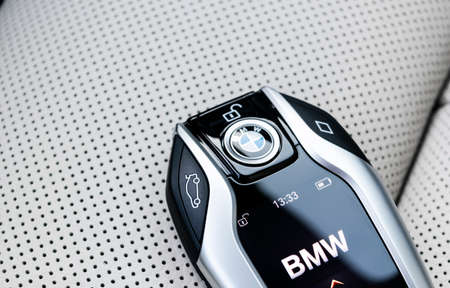Helsinki, Finland, January 2, 2020: Close up of modern wireless keys of BMW 640i GT 2019 in white leather car interior. Modern Car interior details. Car insideのeditorial素材