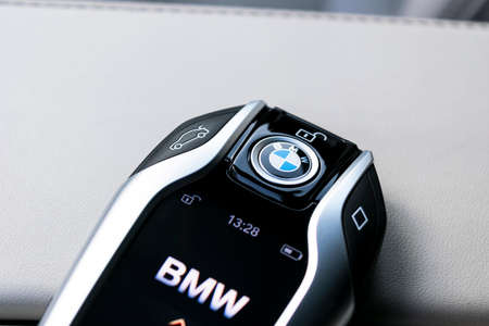 Helsinki, Finland, January 2, 2020: Close up of modern wireless keys of BMW 640i GT 2019 in white leather car interior. Modern Car interior details. Car insideのeditorial素材