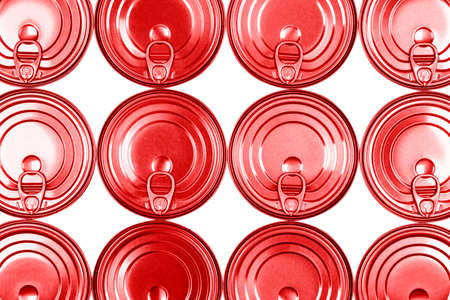 Close up photo of red aluminium cans in a raw isolated on white background. Aluminium can...