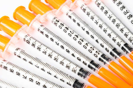 Pile of insulin syringe for diabetes isolated on white background. Close-up empty syringe isolated...