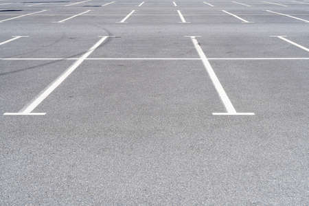 Empty car parking near shopping mall. Modern parking lot. Carpark. Empty parking spaces at the...
