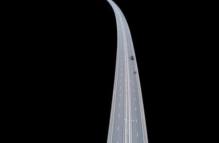 Aerial view of highway in city isolated on black background. Cars crossing interchange overpass....