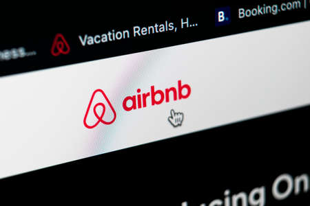 Sankt-Petersburg, Russia, May 11, 2020: Airbnb application homepage on Apple iMac screen close-up. Airbnb app icon. Airbnb.com is online website for booking rooms.のeditorial素材