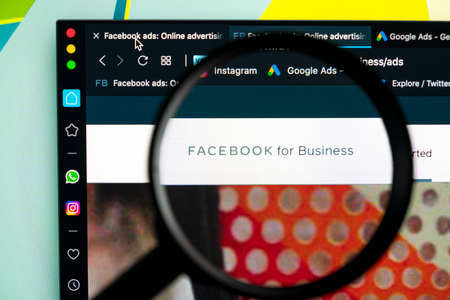 Sankt-Petersburg, Russia, June 16, 2020: Facebook Ads application icon on Apple iMac screen under magnifying glass. Facebook Business app icon. Facebook Ads mobile application. Social mediaのeditorial素材