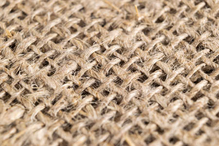 Macro shot yellow linen fabric texture. Linen natural canvas texture with pattern. Fabric texture....