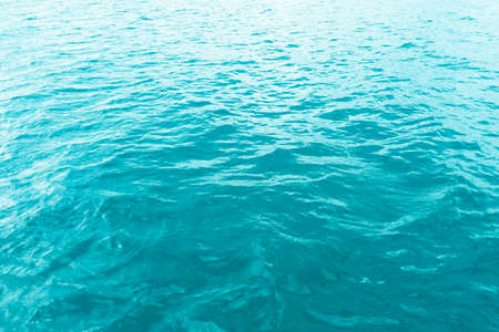 Aerial view of a crystal clear sea turquoise water texture. View from above Natural blue background. Turquoise water reflection. Blue ocean wave. Summer sea. Drone. Top viewの写真素材